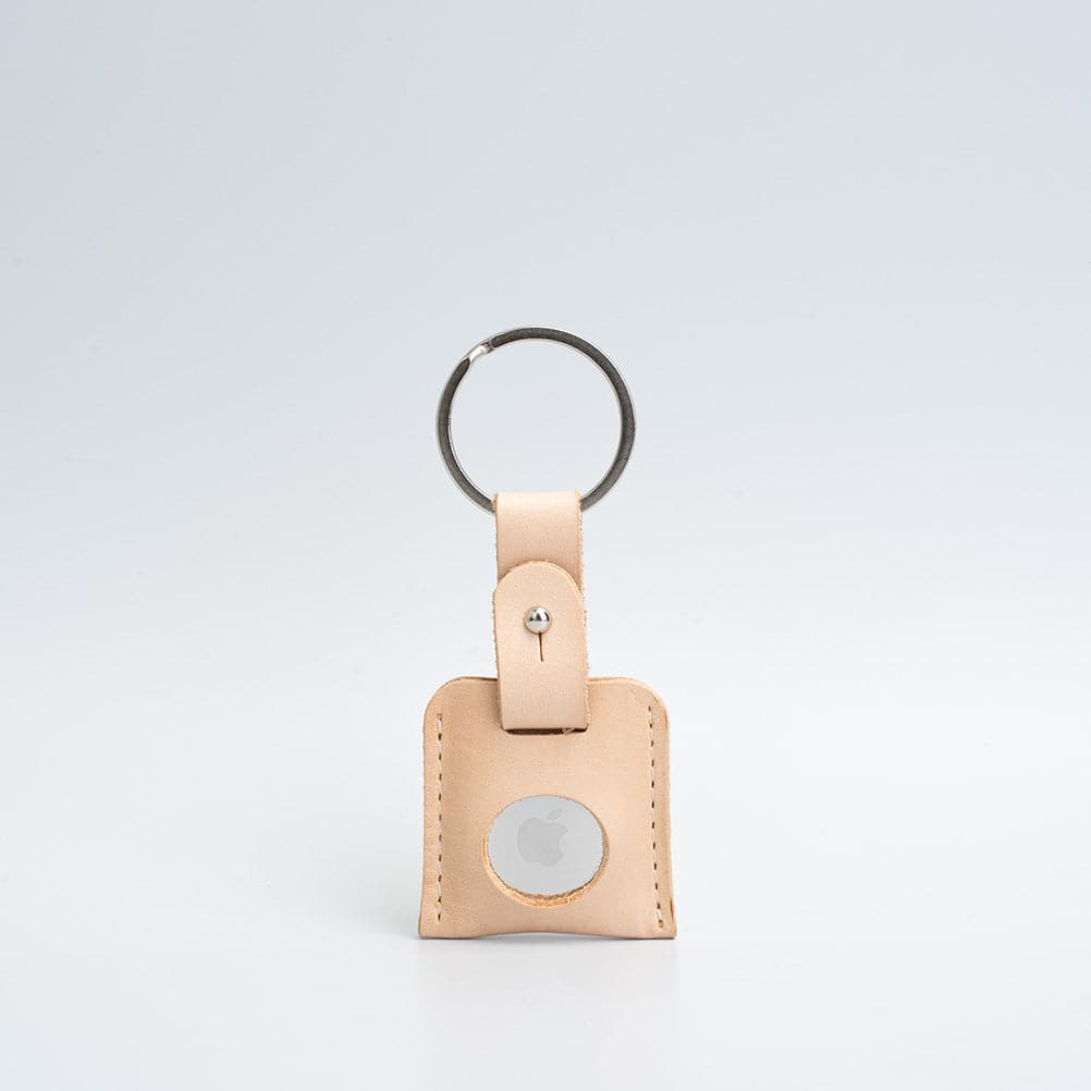 A stylish Leather AirTag Keyring made from premium Italian leather, showcasing its craftsmanship and customizable features.