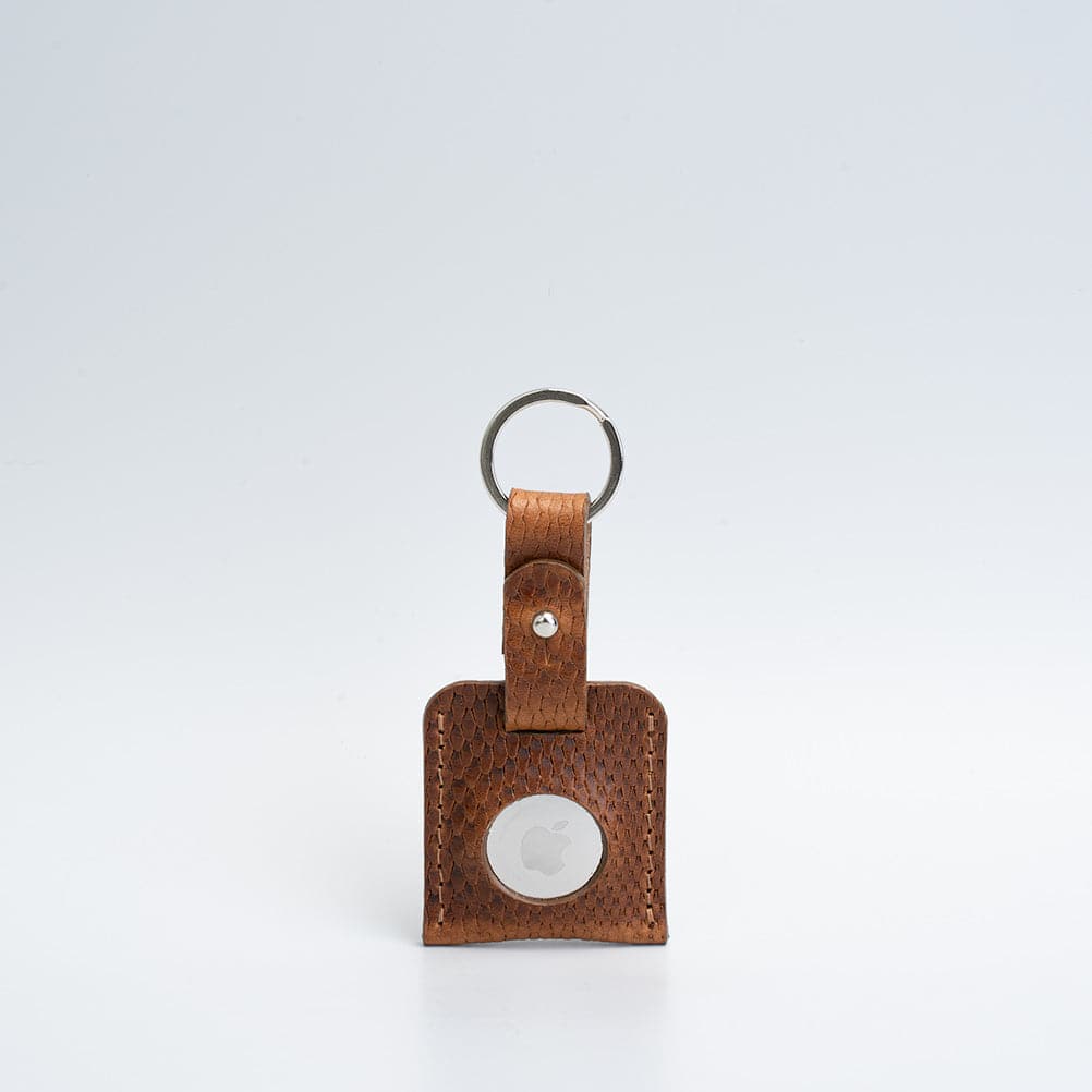 A stylish Leather AirTag Keyring made from premium Italian leather, showcasing its craftsmanship and customizable features.