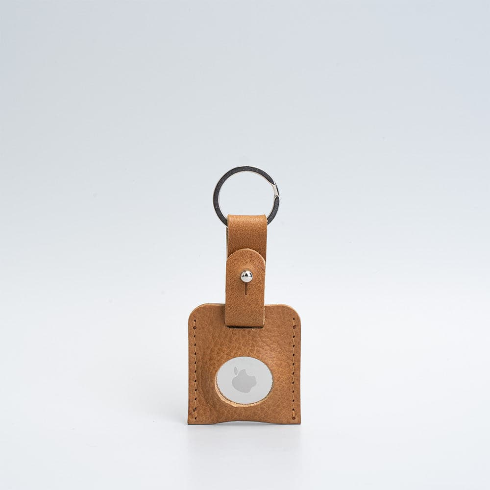 A stylish Leather AirTag Keyring made from premium Italian leather, showcasing its craftsmanship and customizable features.