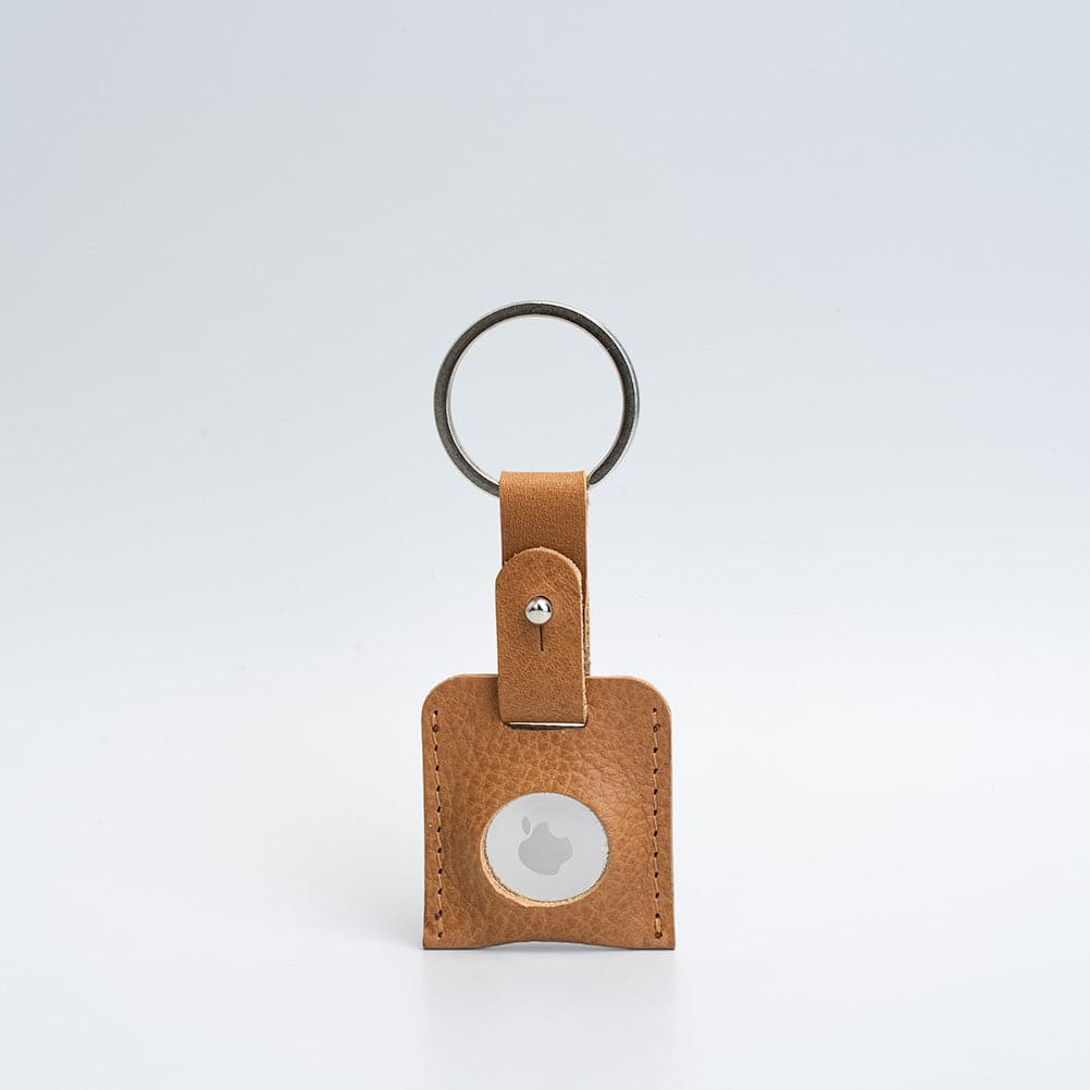 A stylish Leather AirTag Keyring made from premium Italian leather, showcasing its craftsmanship and customizable features.