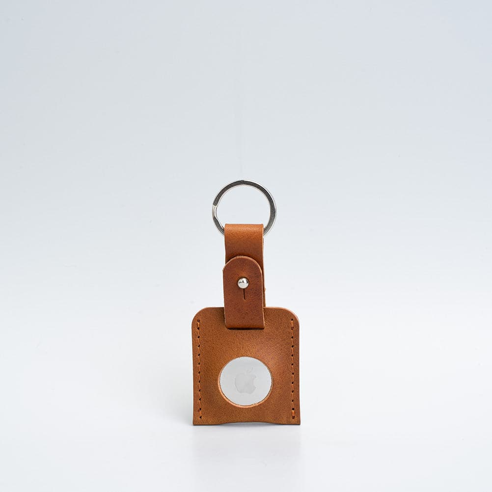 A stylish Leather AirTag Keyring made from premium Italian leather, showcasing its craftsmanship and customizable features.