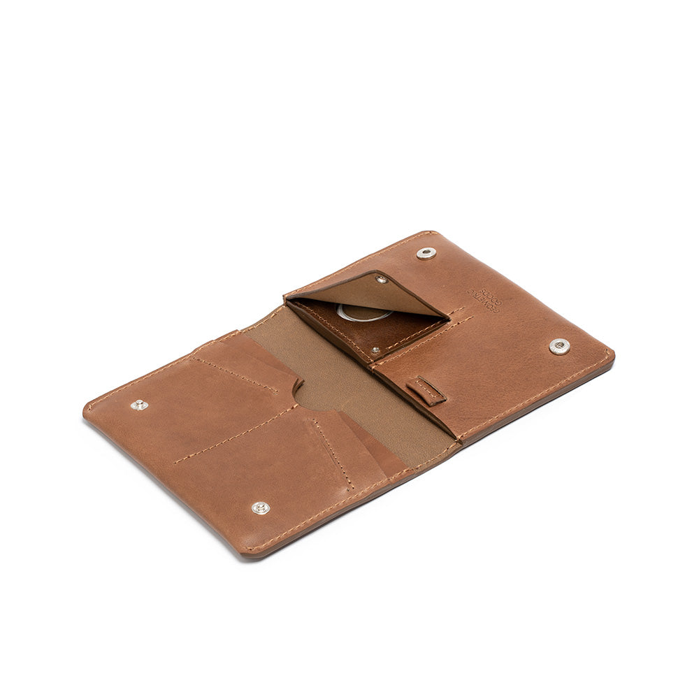 Leather AirTag Travel Wallet in Italian vegetable tanned leather, featuring a hidden AirTag pocket and snap button closure.