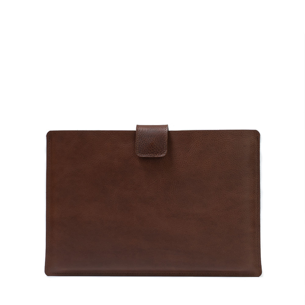 A premium leather bag for MacBook featuring a zipper pocket, crafted from full-grain leather with a wool felt lining.