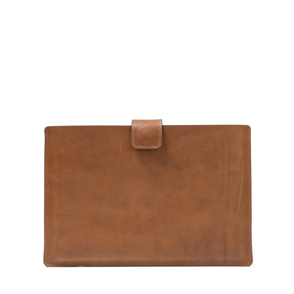 A premium leather bag for MacBook featuring a zipper pocket, crafted from full-grain leather with a wool felt lining.