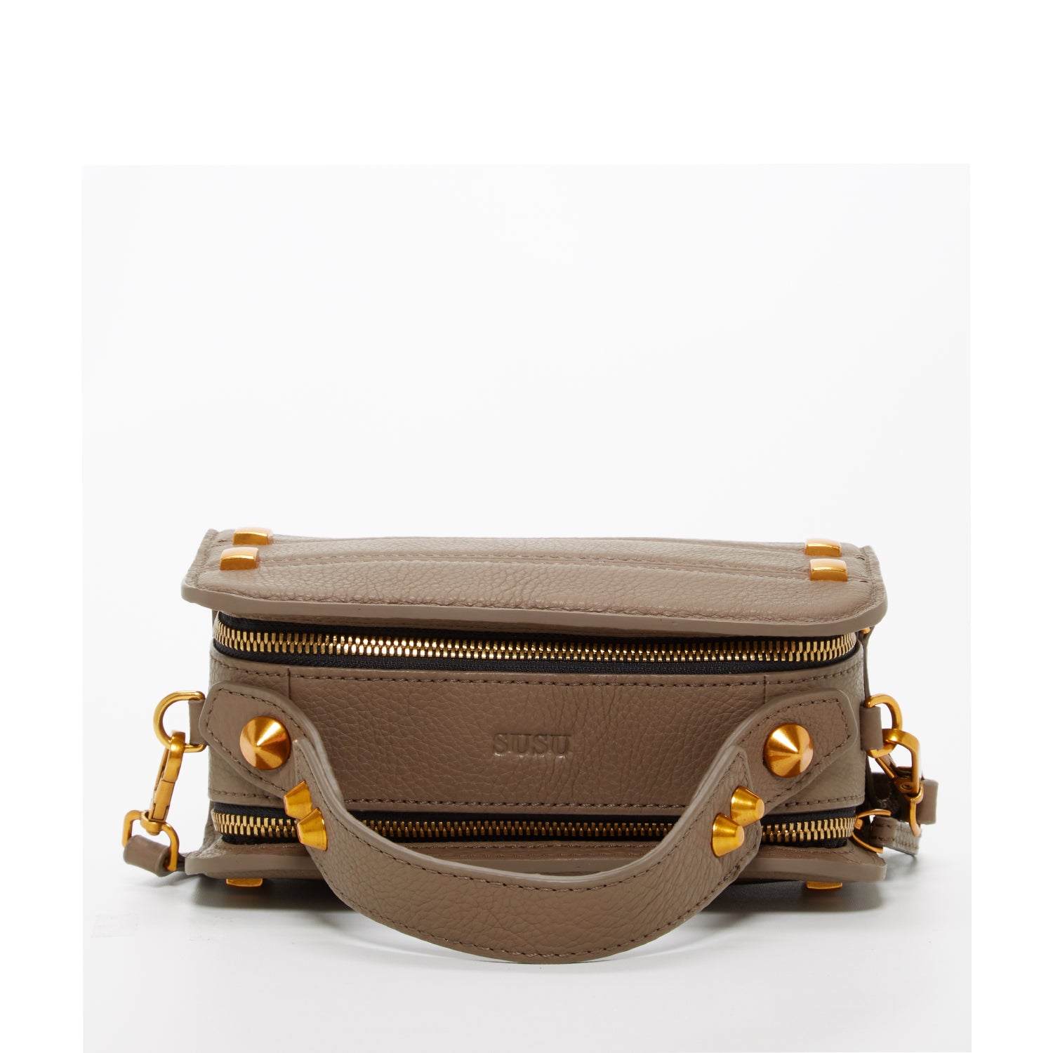 Mocha brown leather crossbody bag with rose gold studs and hardware, featuring a boxy silhouette and adjustable strap.