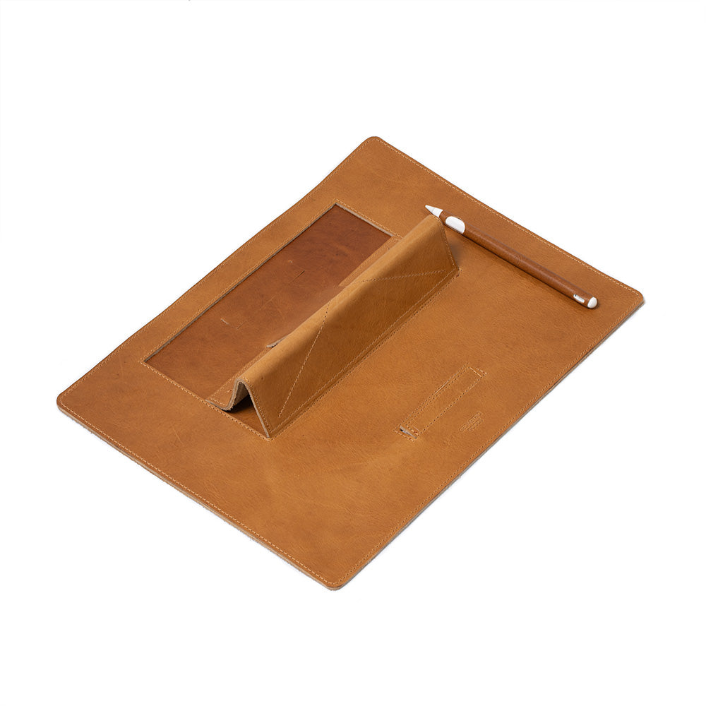 Leather Desktop Mat for iPad showcasing premium Italian leather with a minimalist design, featuring adjustable elevation angles.