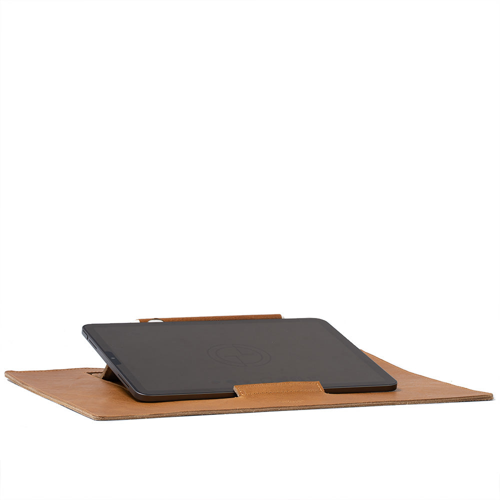 Leather Desktop Mat for iPad showcasing premium Italian leather with a minimalist design, featuring adjustable elevation angles.