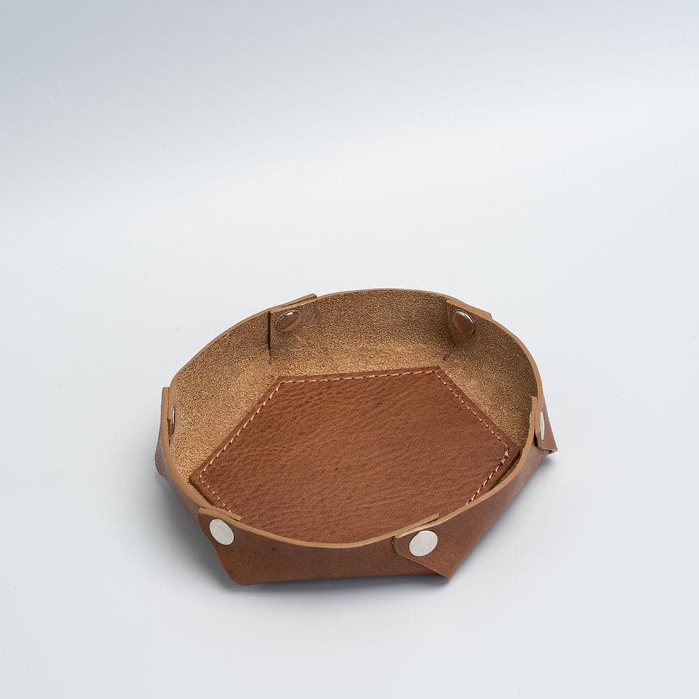 Handcrafted leather desktop organizer in hexagon shape, available in multiple colors and sizes.