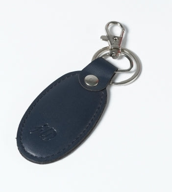 Blue leather keychain with silver metal hook and ring, featuring thread stitching and JILD logo embossing.