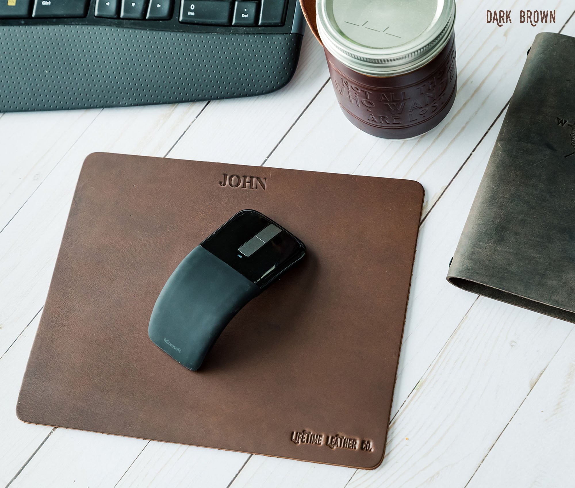 A stylish genuine full grain leather mouse pad with a smooth surface, perfect for office and gaming use.