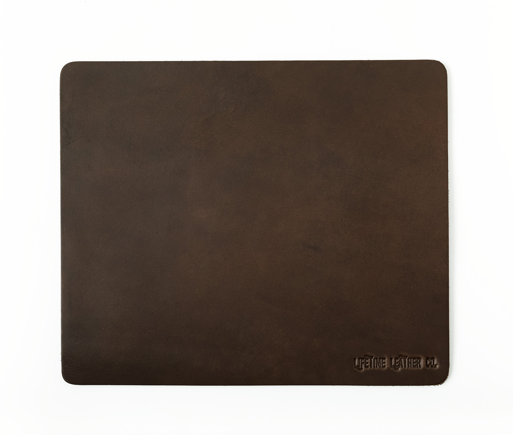 A stylish genuine full grain leather mouse pad with a smooth surface, perfect for office and gaming use.