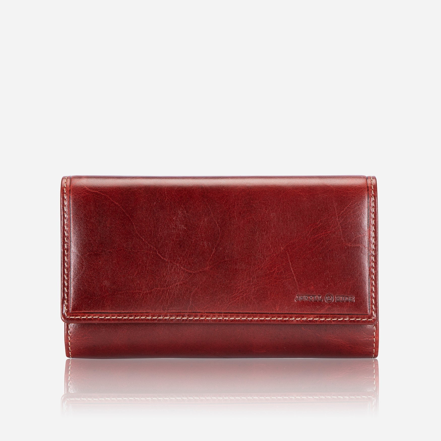 Elegant rust leather purse with double-studded design, showcasing its slim and versatile style.