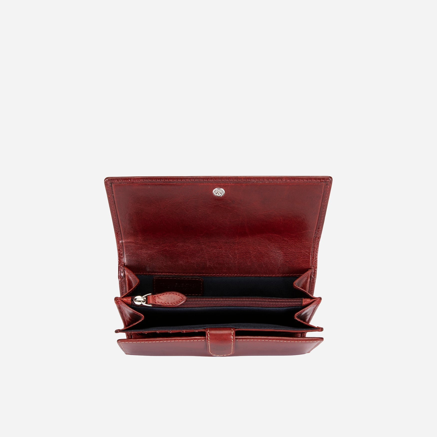 Elegant rust leather purse with double-studded design, showcasing its slim and versatile style.