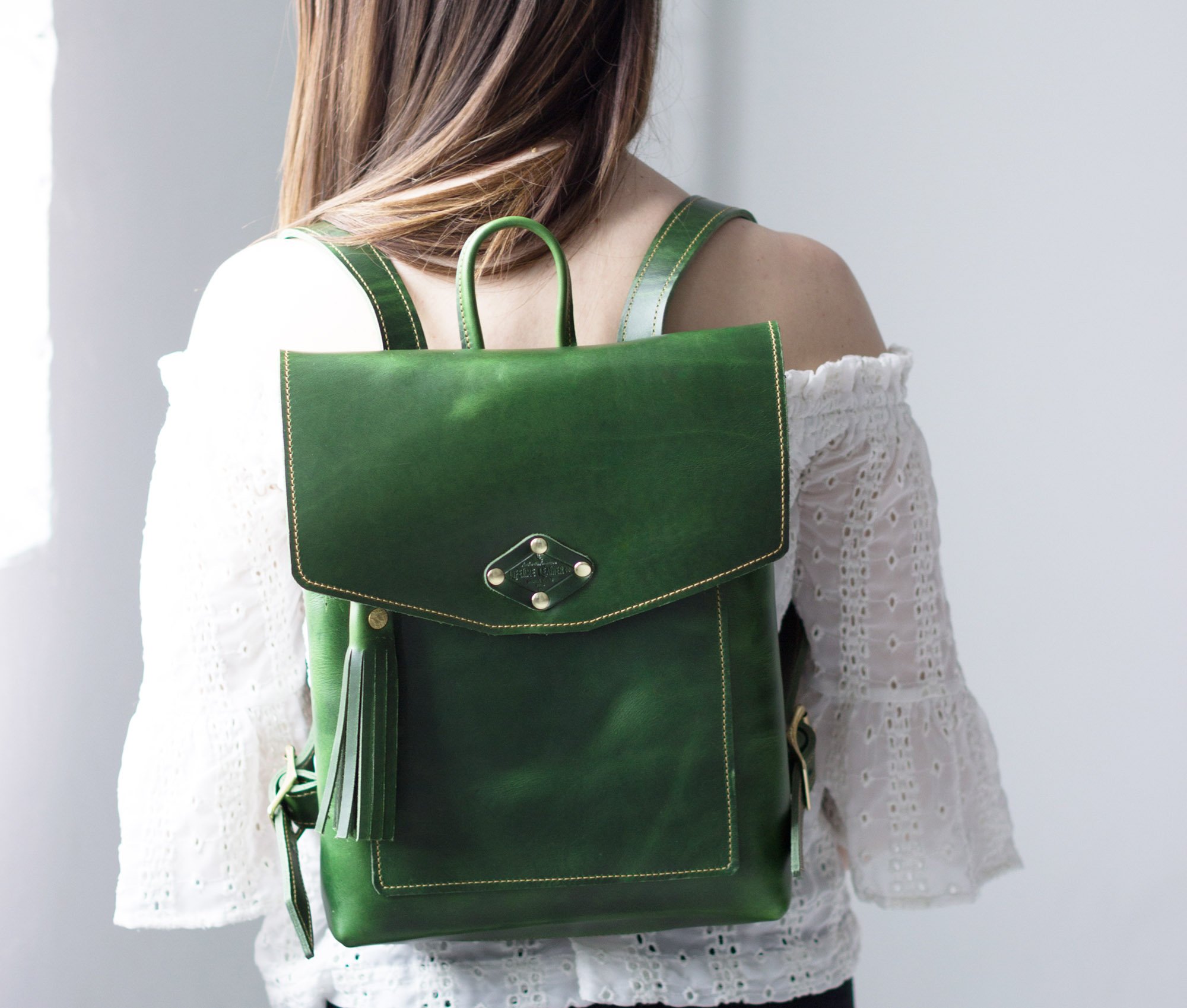 Stylish Leather Rucksack made from full grain leather with adjustable straps and exterior pocket.