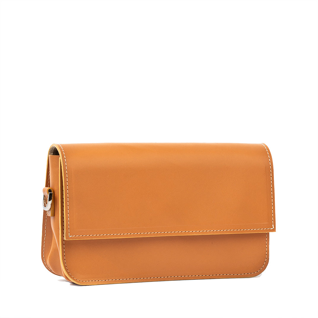 Light orange leather shoulder bag with structured design and adjustable strap, showcasing premium Italian craftsmanship.