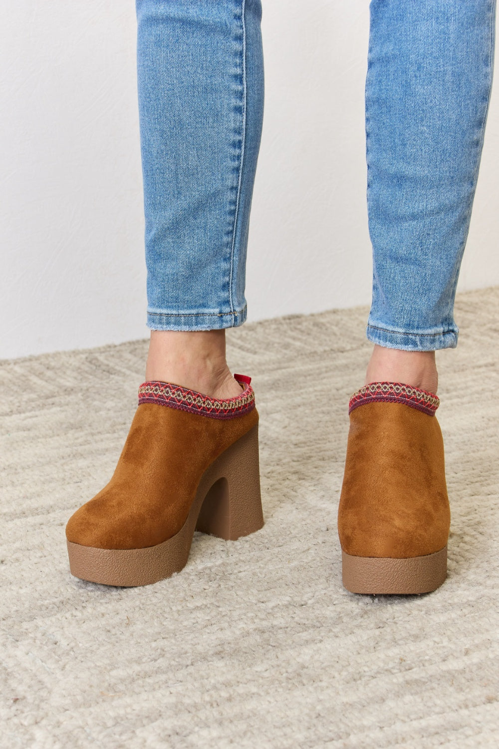 Stylish Legend Footwear Platform Suede Clog Heels with a high heel and soft suede finish, perfect for fashion-forward outfits.