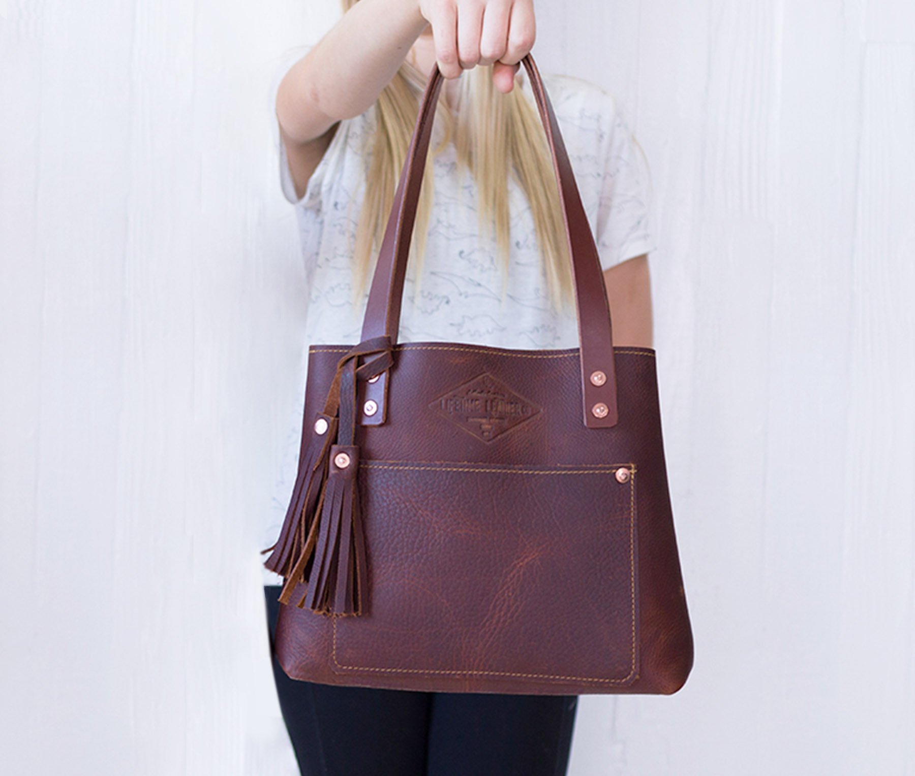 Lifetime Mini Tote in Pebble color, crafted from genuine full grain leather, featuring a pebbled texture and sturdy design.