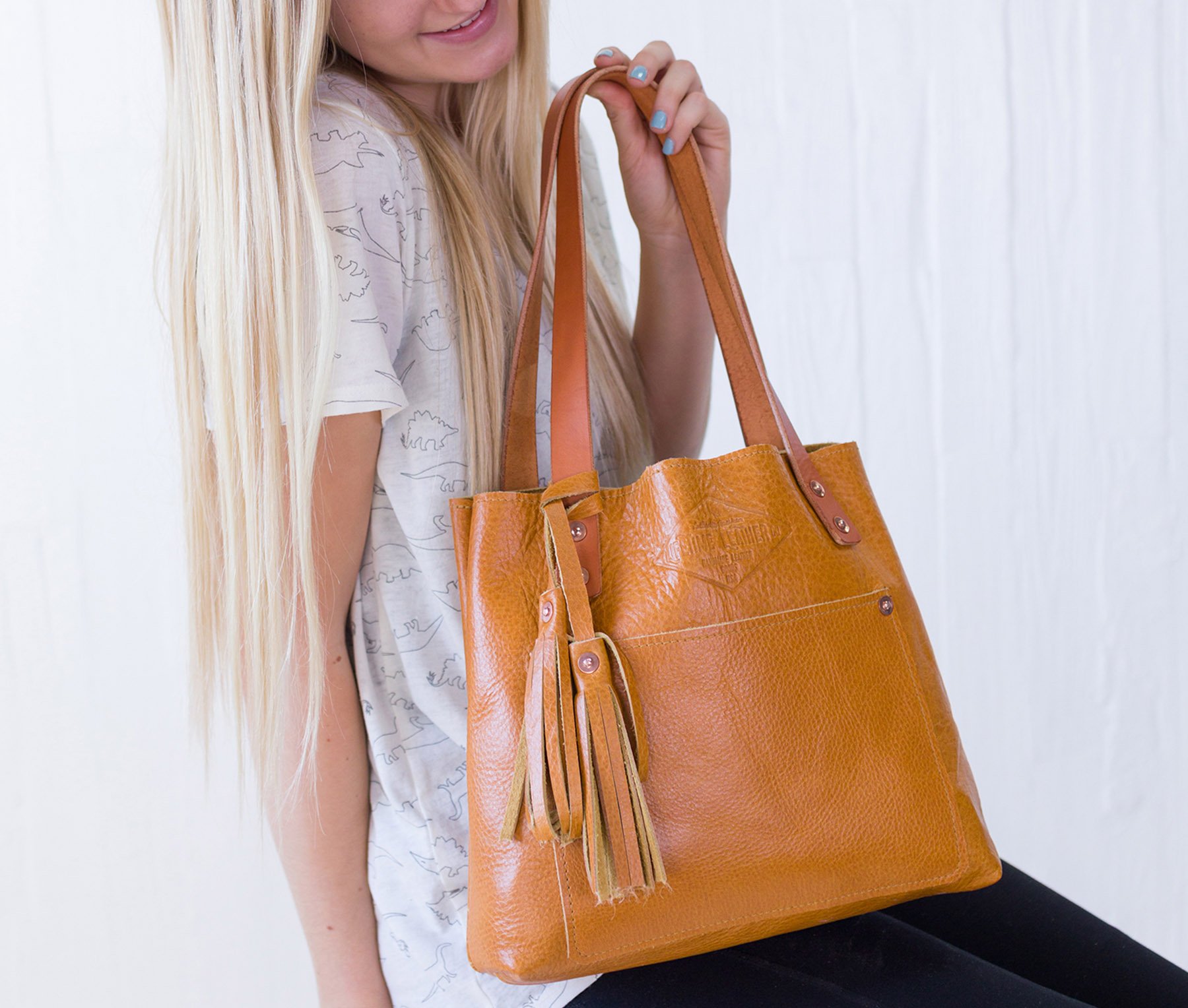 Lifetime Mini Tote in Pebble color, crafted from genuine full grain leather, featuring a pebbled texture and sturdy design.