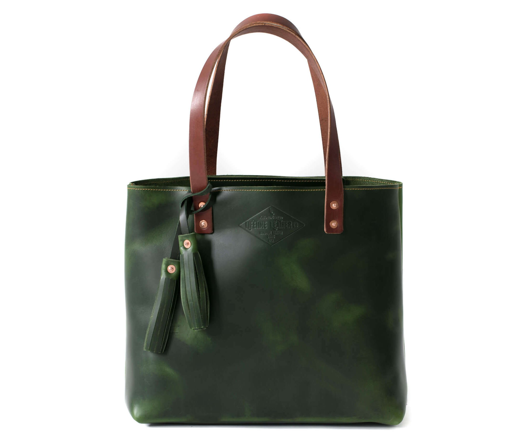 A stylish Lifetime Tote bag made from full grain leather, showcasing its minimalist design and spacious interior.