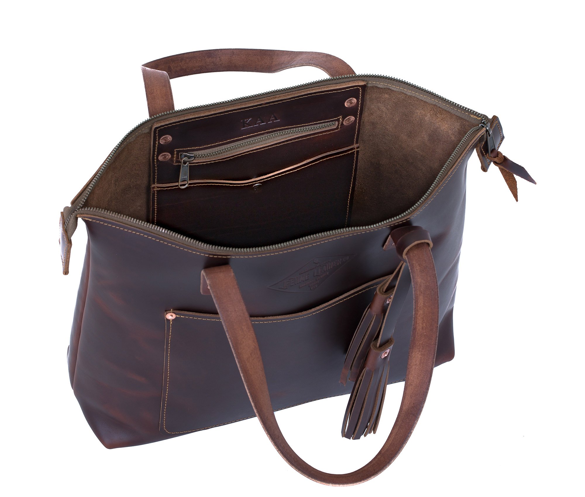 Lifetime Zippered Tote in Pebble leather, featuring a zippered top, front pocket, and interior organization pockets.