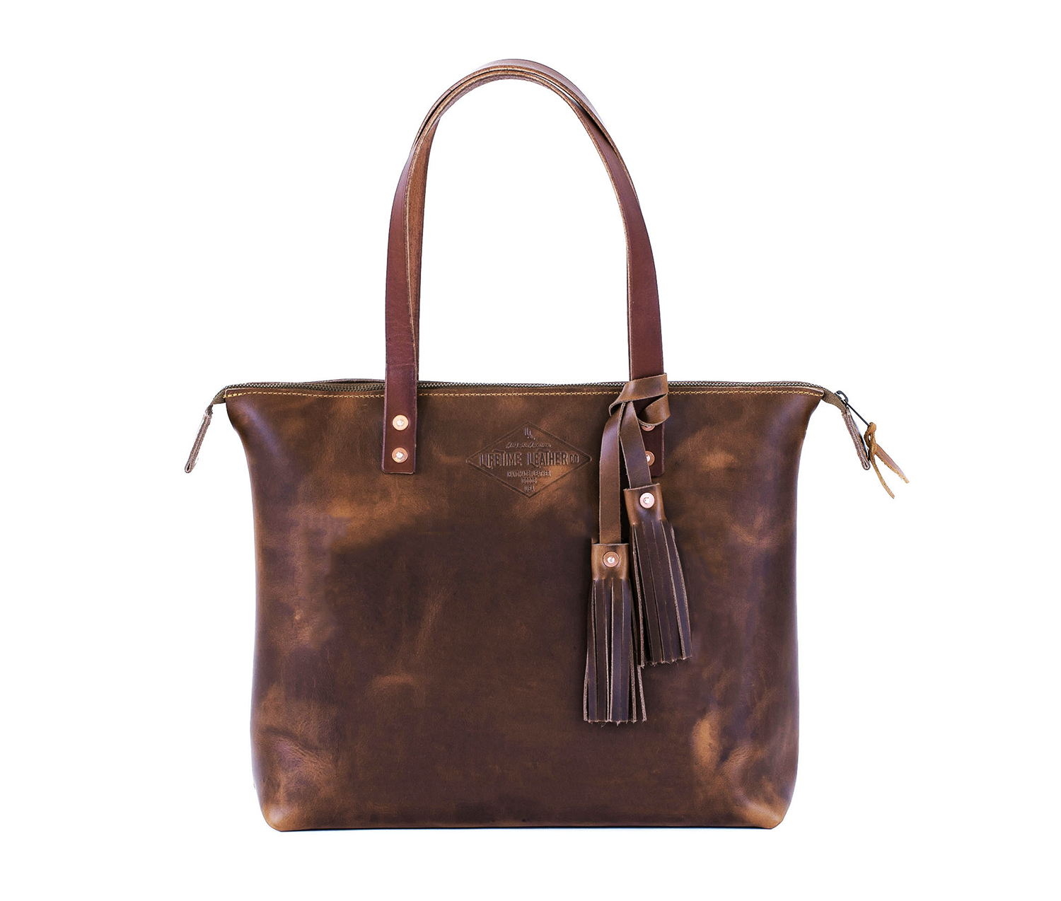 Lifetime Zippered Tote made of genuine American full grain leather, featuring a zippered top and multiple interior pockets.