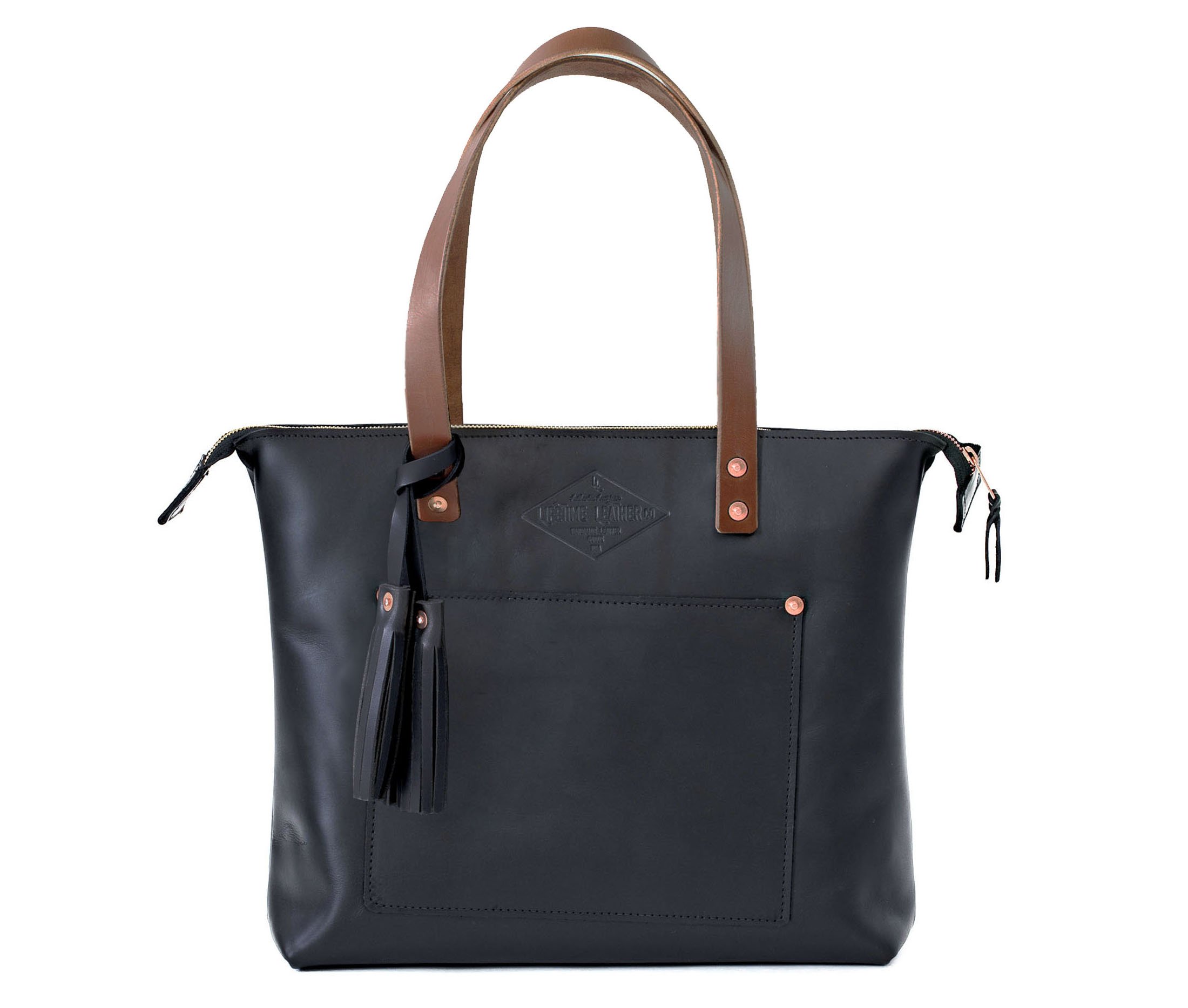 Lifetime Zippered Tote made of genuine American full grain leather, featuring a zippered top and multiple interior pockets.