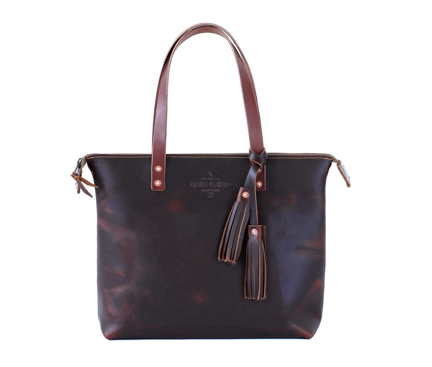 Lifetime Zippered Tote made of genuine American full grain leather, featuring a zippered top and multiple interior pockets.