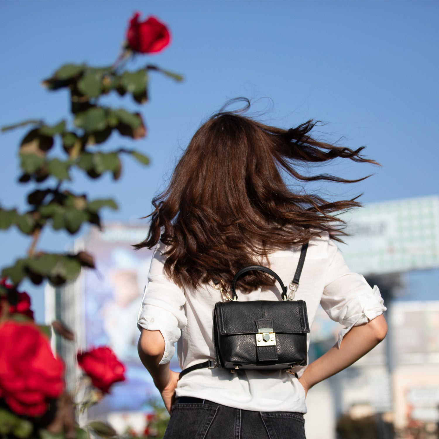 Linda Black Crossbody Backpack Purse made of soft Italian pebble leather with gold hardware, showcasing its stylish design and versatility.