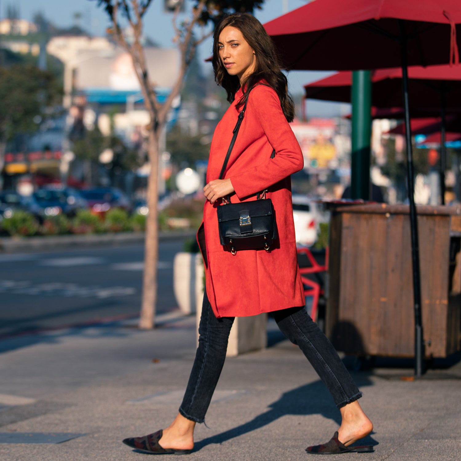 Linda Black Crossbody Backpack Purse made of soft Italian pebble leather with gold hardware, showcasing its stylish design and versatility.