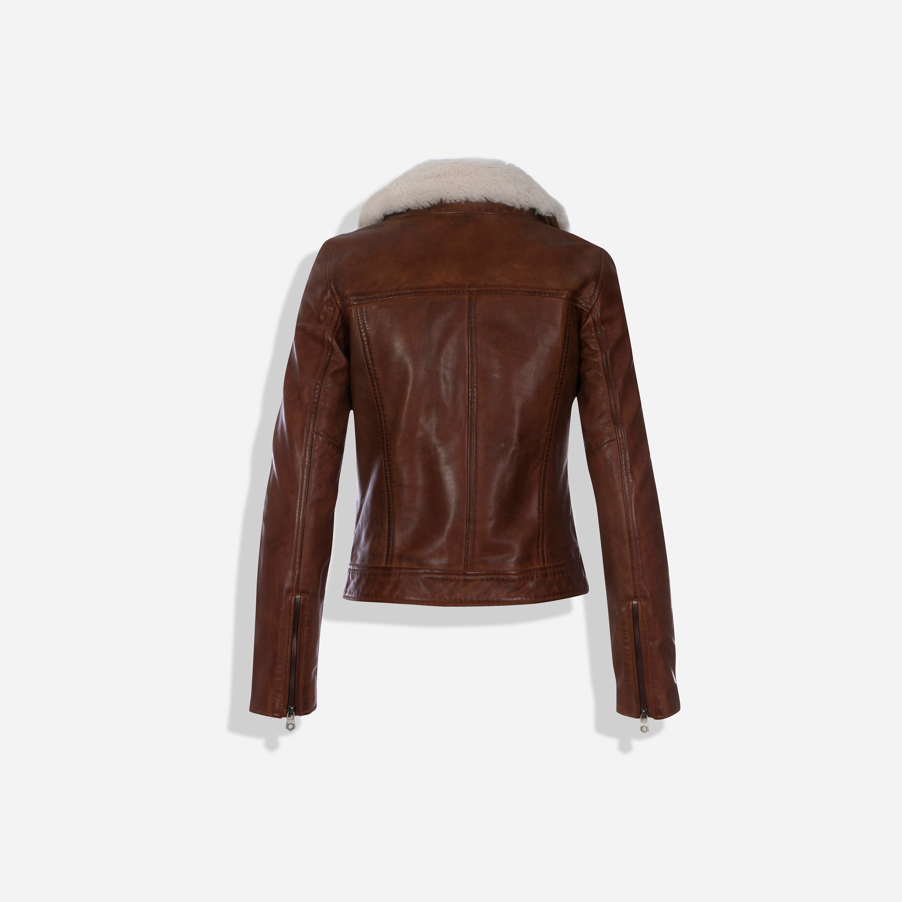 Lisa Bomber Jacket in Cognac featuring a detachable sheep fur collar and multiple pockets, showcasing a stylish and practical design.