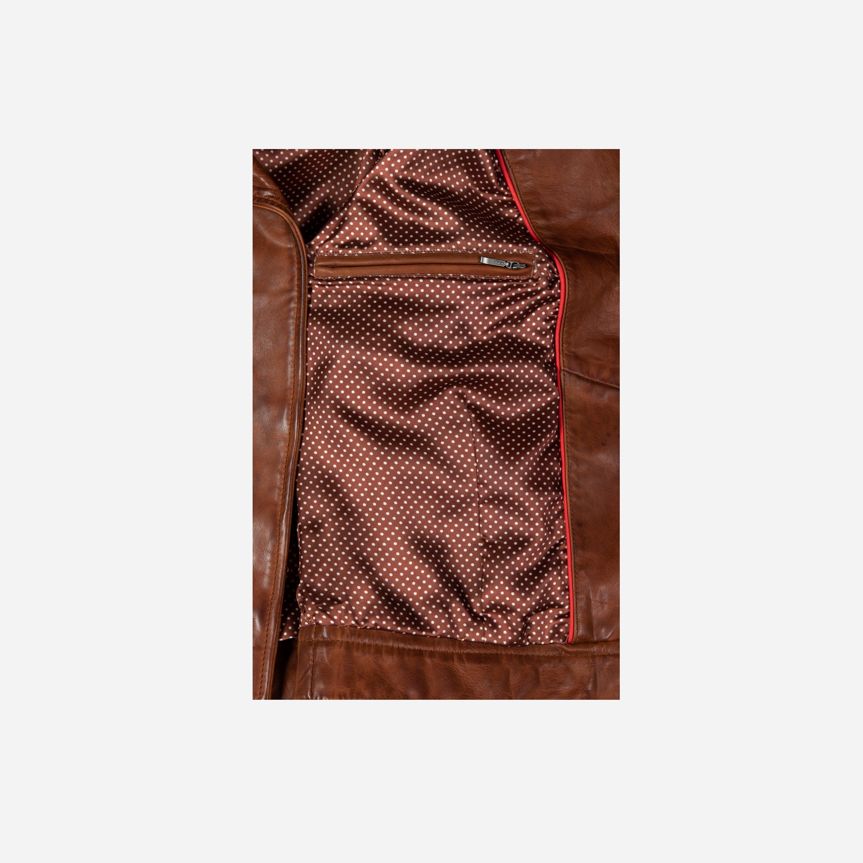 Lisa Bomber Jacket in Cognac featuring a detachable sheep fur collar and multiple pockets, showcasing a stylish and practical design.