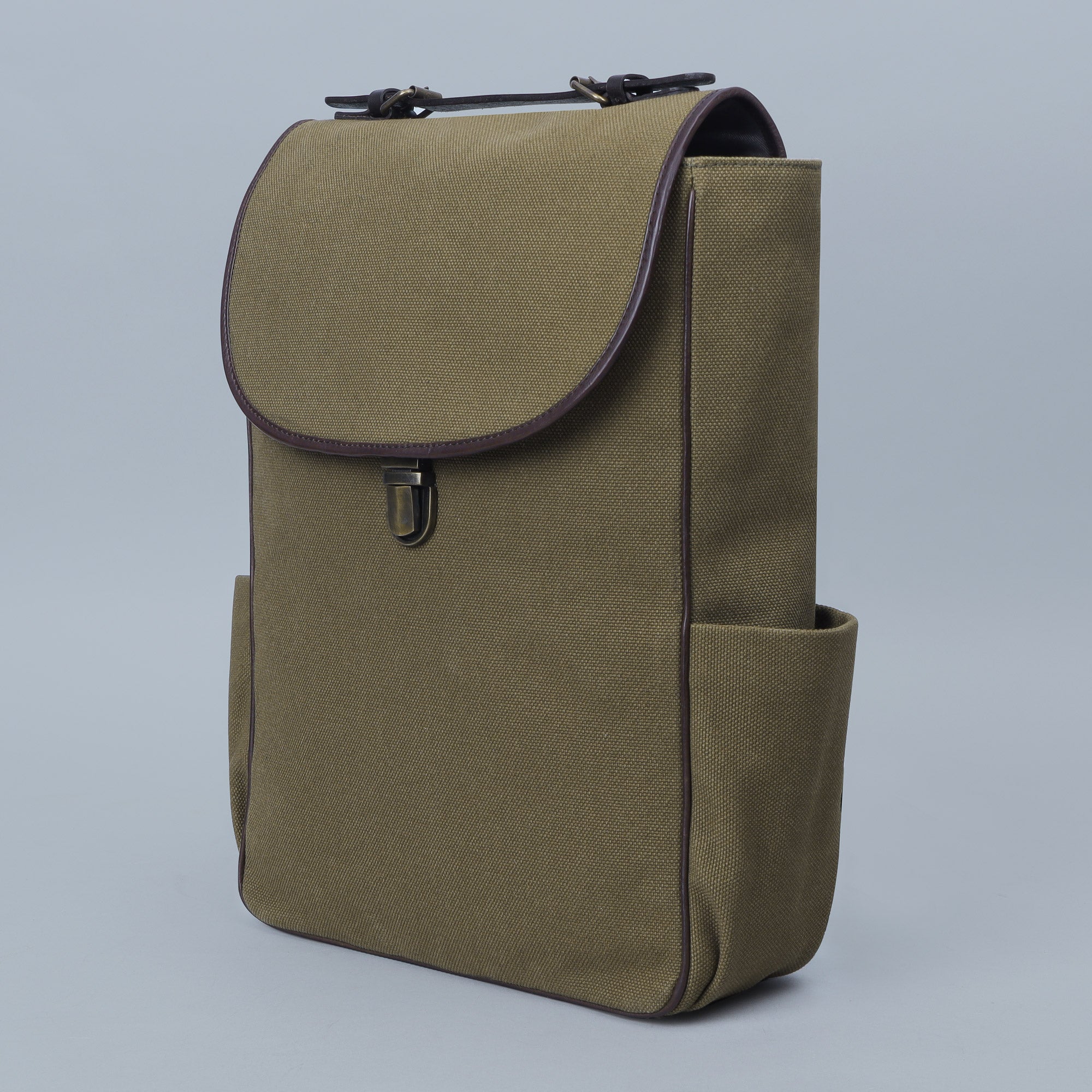 London Canvas Backpack featuring durable cotton canvas, adjustable straps, and multiple pockets for organization.