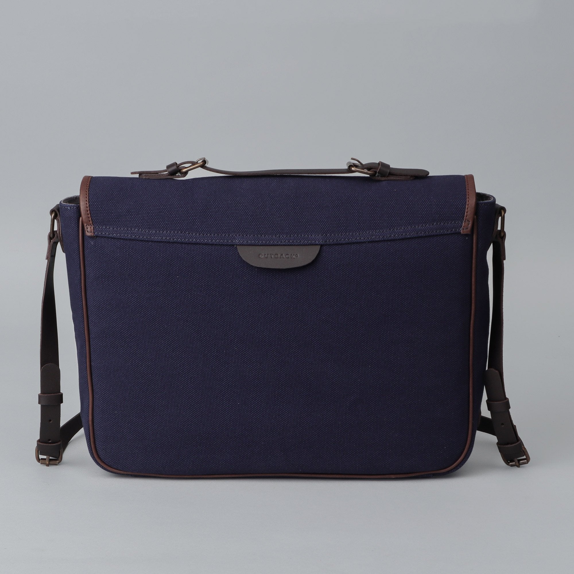 London Canvas Briefcase featuring a separate laptop section, zipper pocket, and durable materials, ideal for professionals.