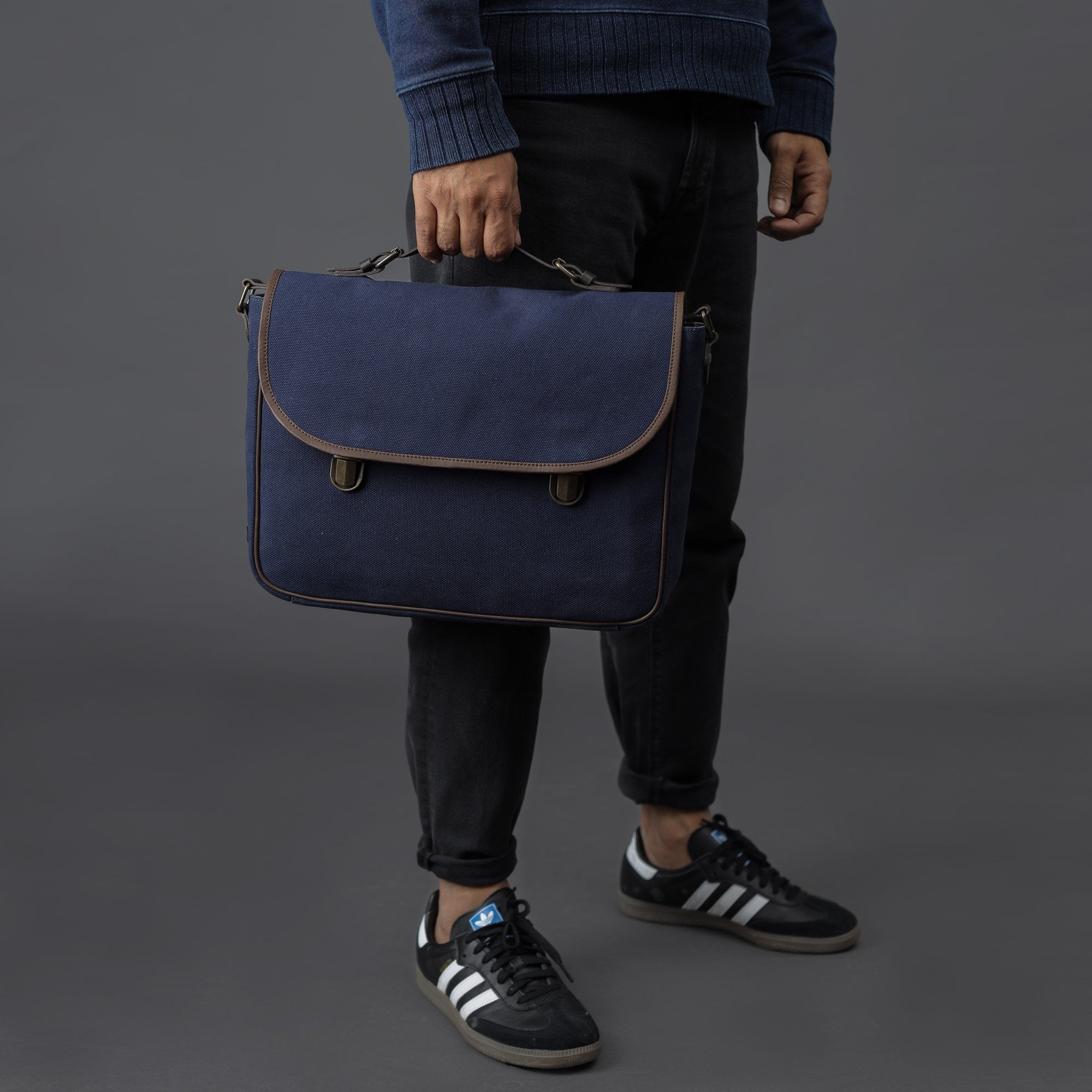 London Canvas Briefcase featuring a separate laptop section, zipper pocket, and durable materials, ideal for professionals.