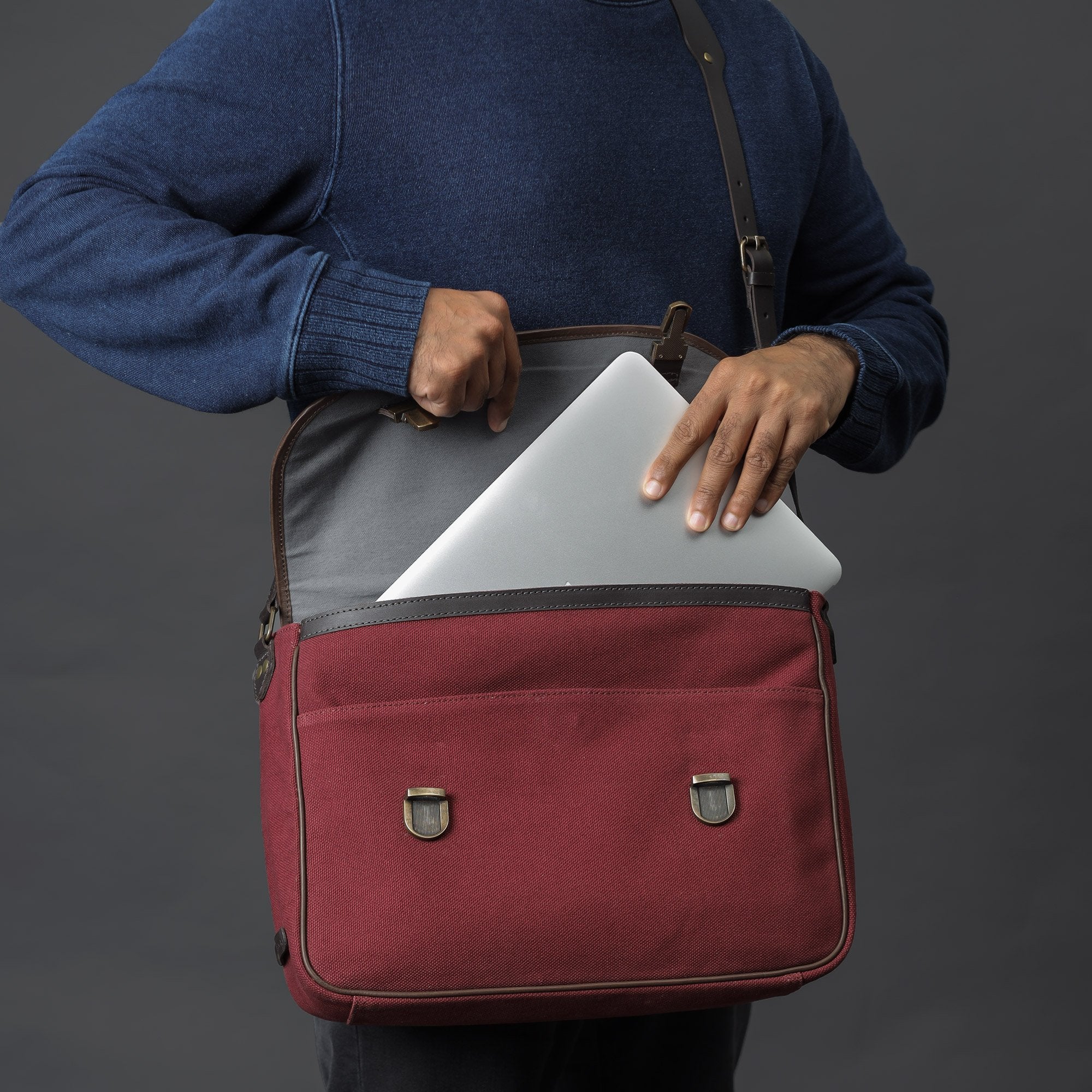 London Canvas Briefcase made from durable cotton canvas with leather straps, featuring a laptop compartment and multiple pockets.