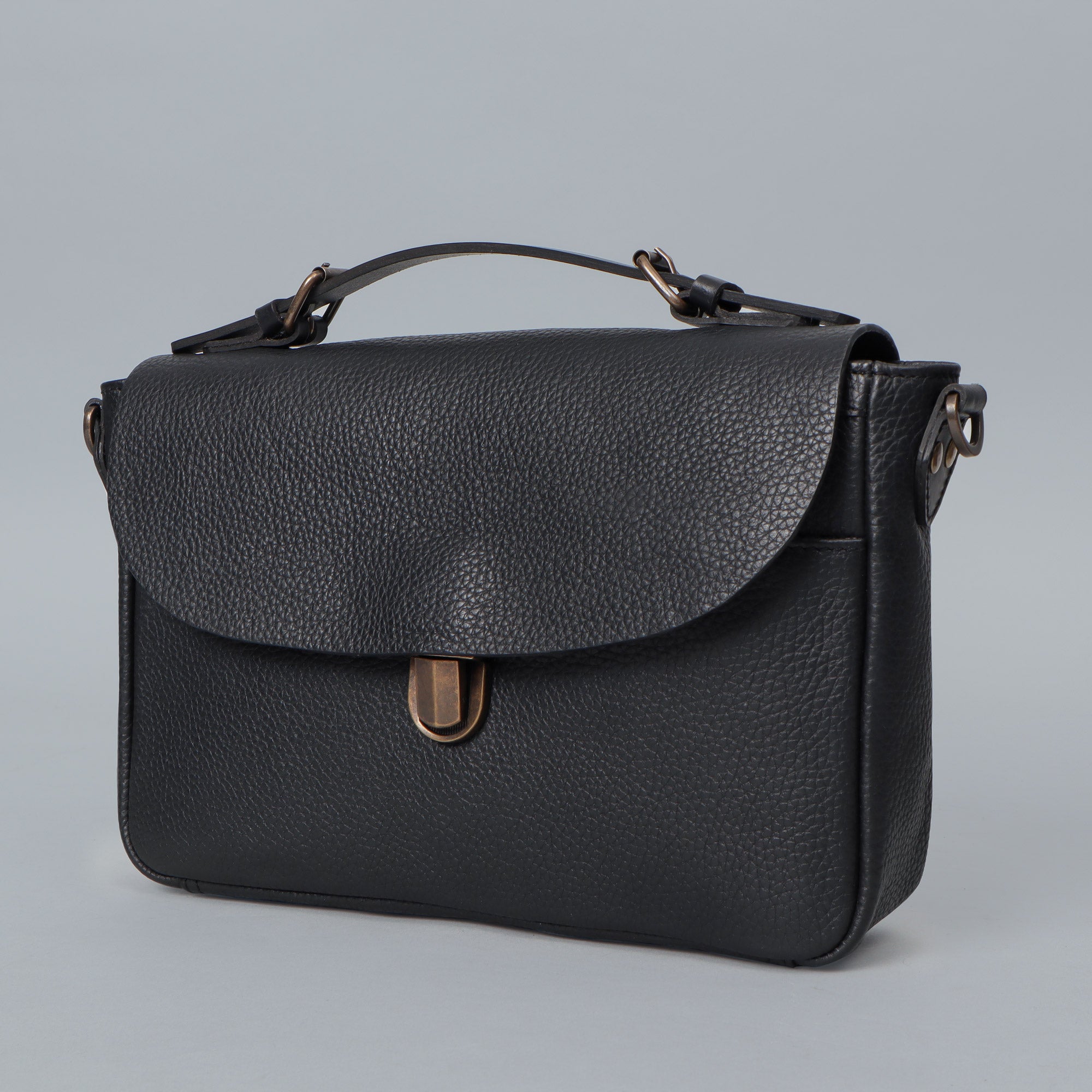 London Crossbody Bag made from premium full grain leather with vintage lock and multiple compartments.