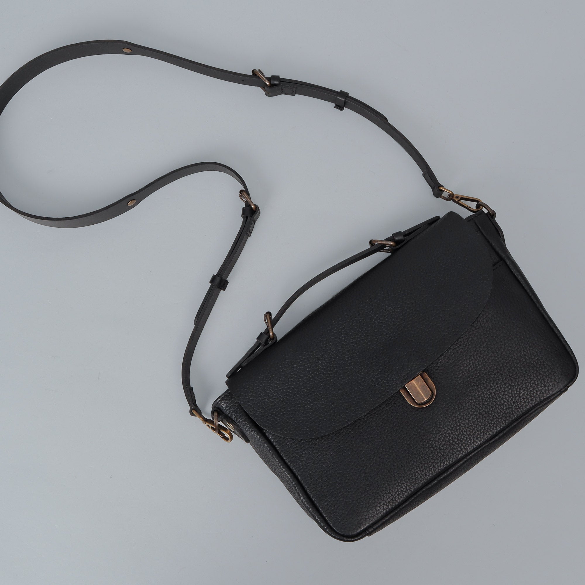 London Crossbody Bag made from premium full grain leather with vintage lock and multiple compartments.