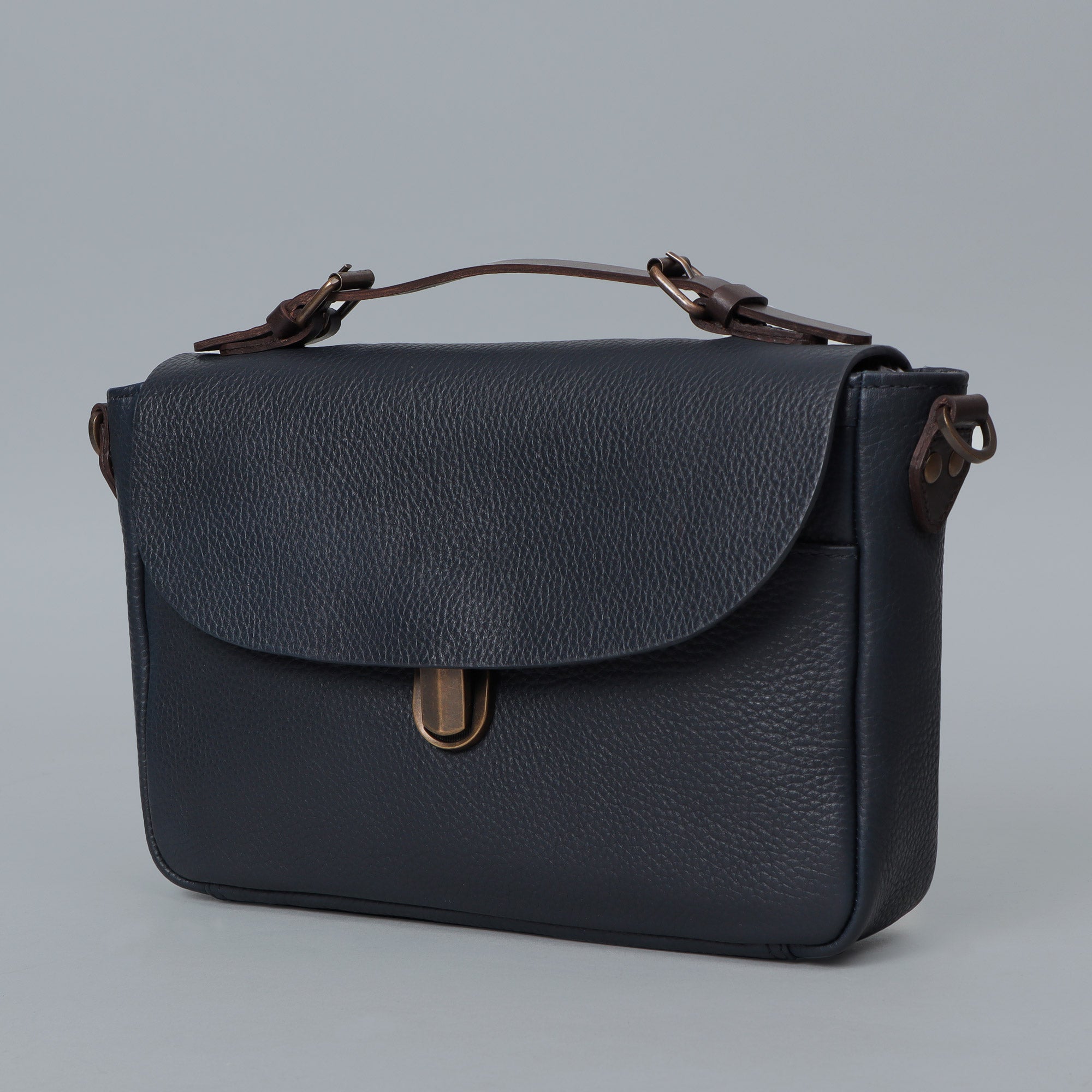 London Crossbody Bag made from premium full grain leather with vintage lock and multiple compartments.