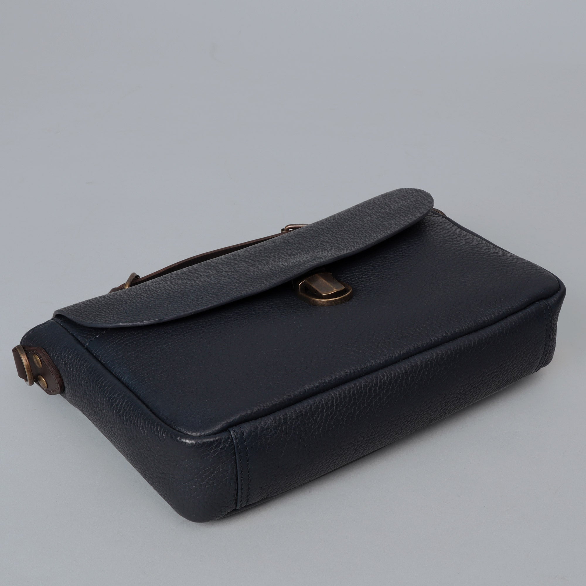 London Crossbody Bag made from premium full grain leather with vintage lock and multiple compartments.