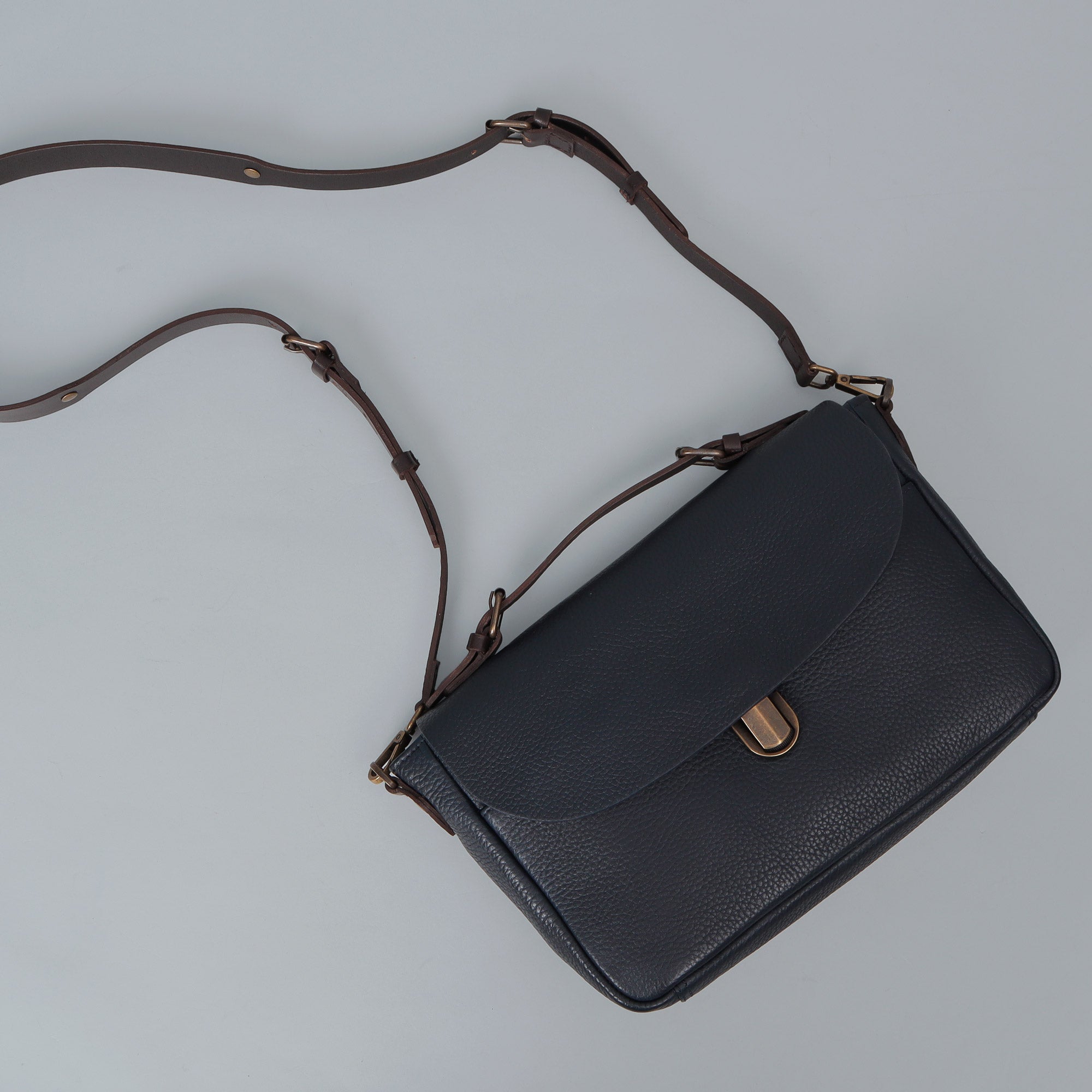 London Crossbody Bag made from premium full grain leather with vintage lock and multiple compartments.