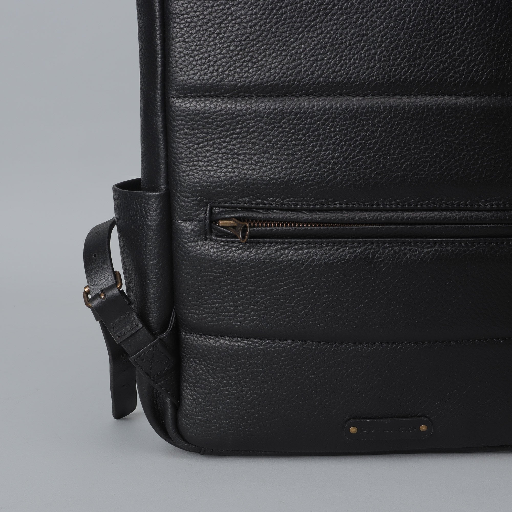 London Leather Backpack made from premium full grain leather, featuring multiple pockets, adjustable straps, and a spacious design for laptops.