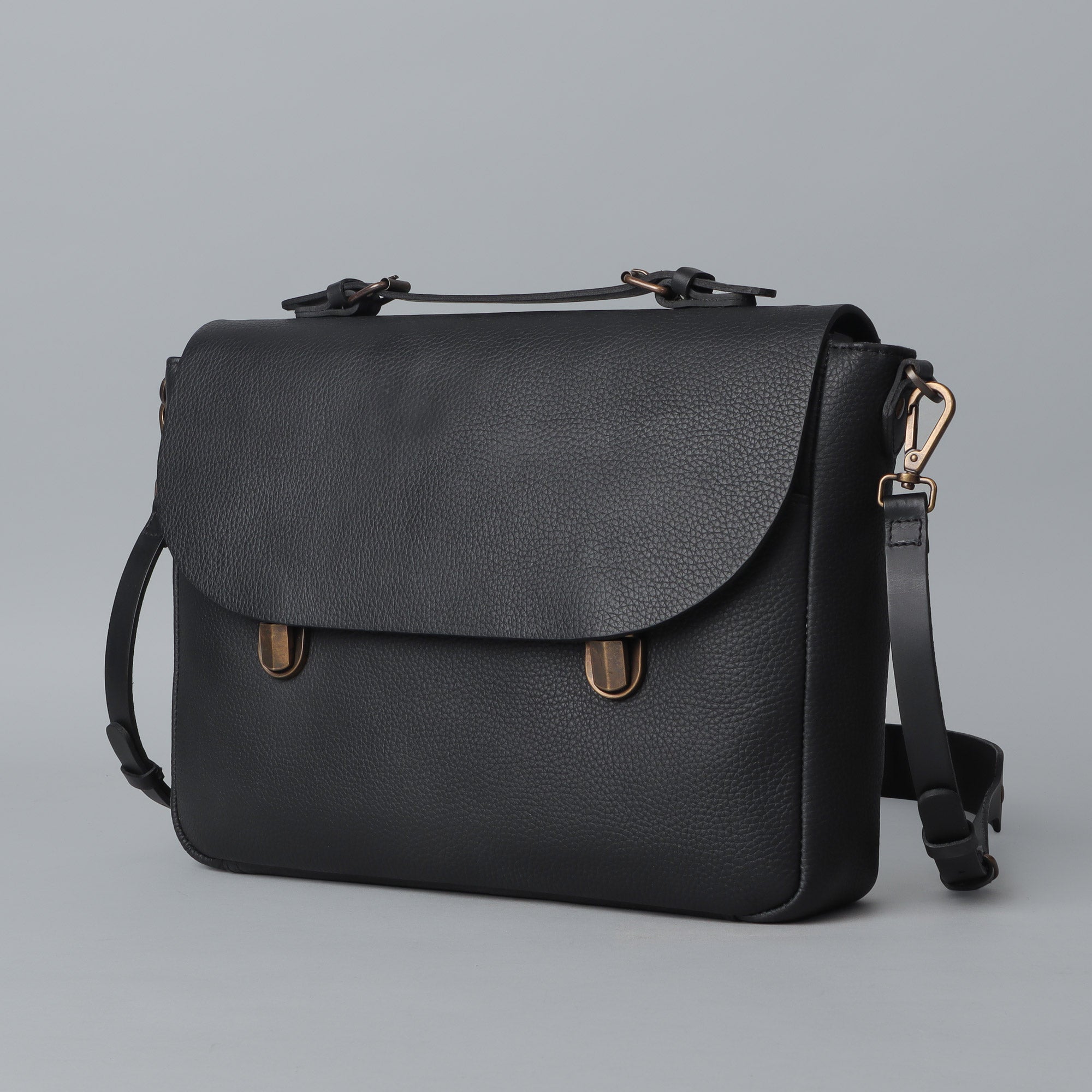 London Leather Briefcase showcasing premium full grain leather, spacious compartments, and a comfortable shoulder strap.