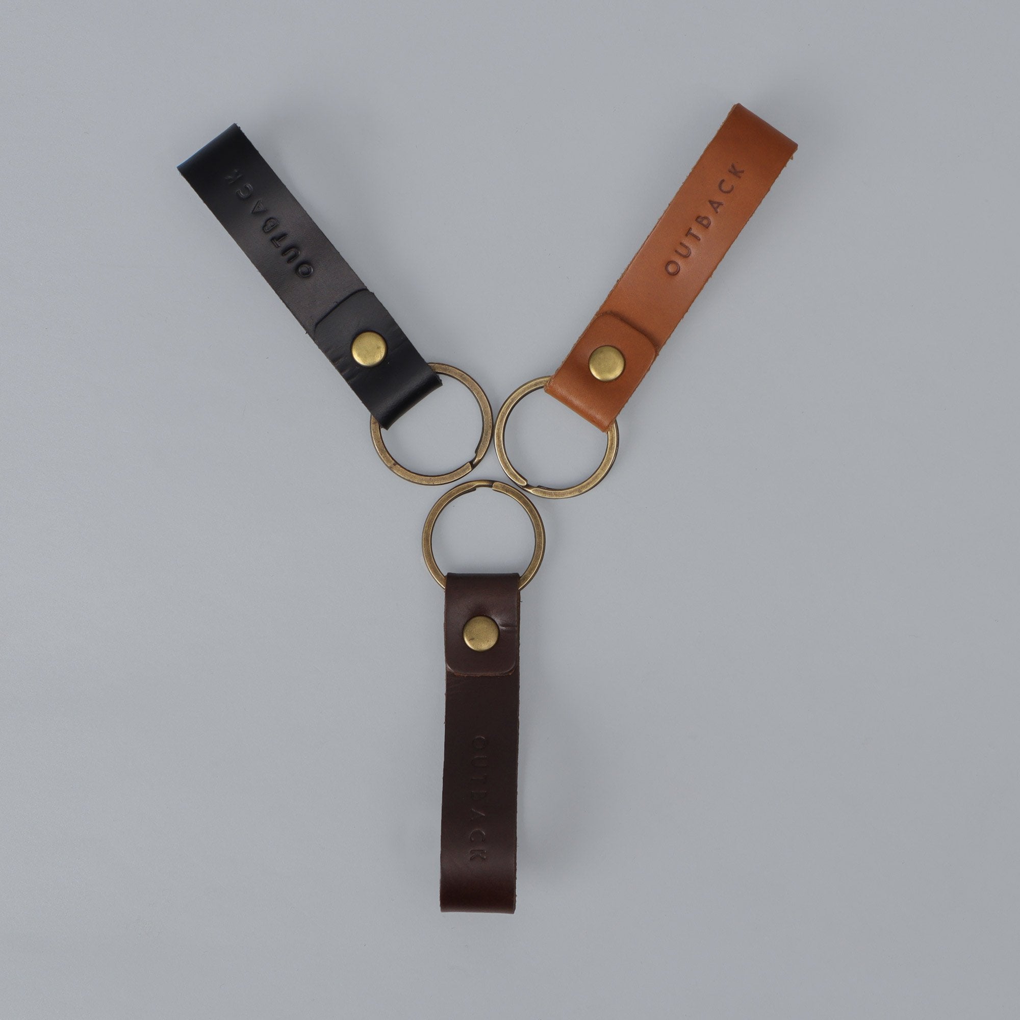 Loop Key Holder made from durable harness leather with antique brass hardware, showcasing its elegant design and craftsmanship.