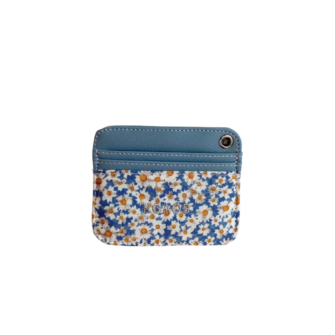 A stylish Lucky Card Holder featuring a mini floral pattern made from pressed fabric and recycled PVC leather, showcasing its compact design.