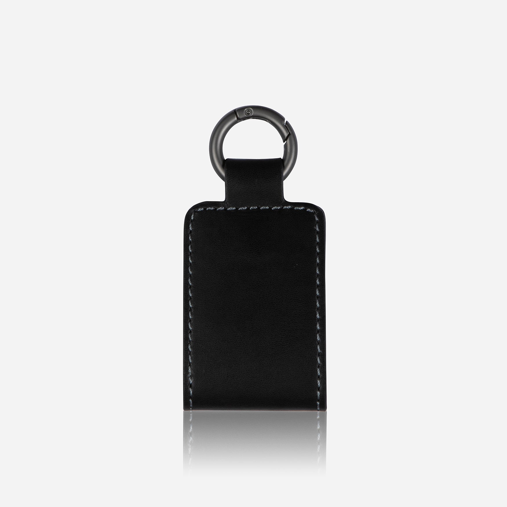 Black leather luggage tag with push ring and press stud closure, ideal for easy identification.