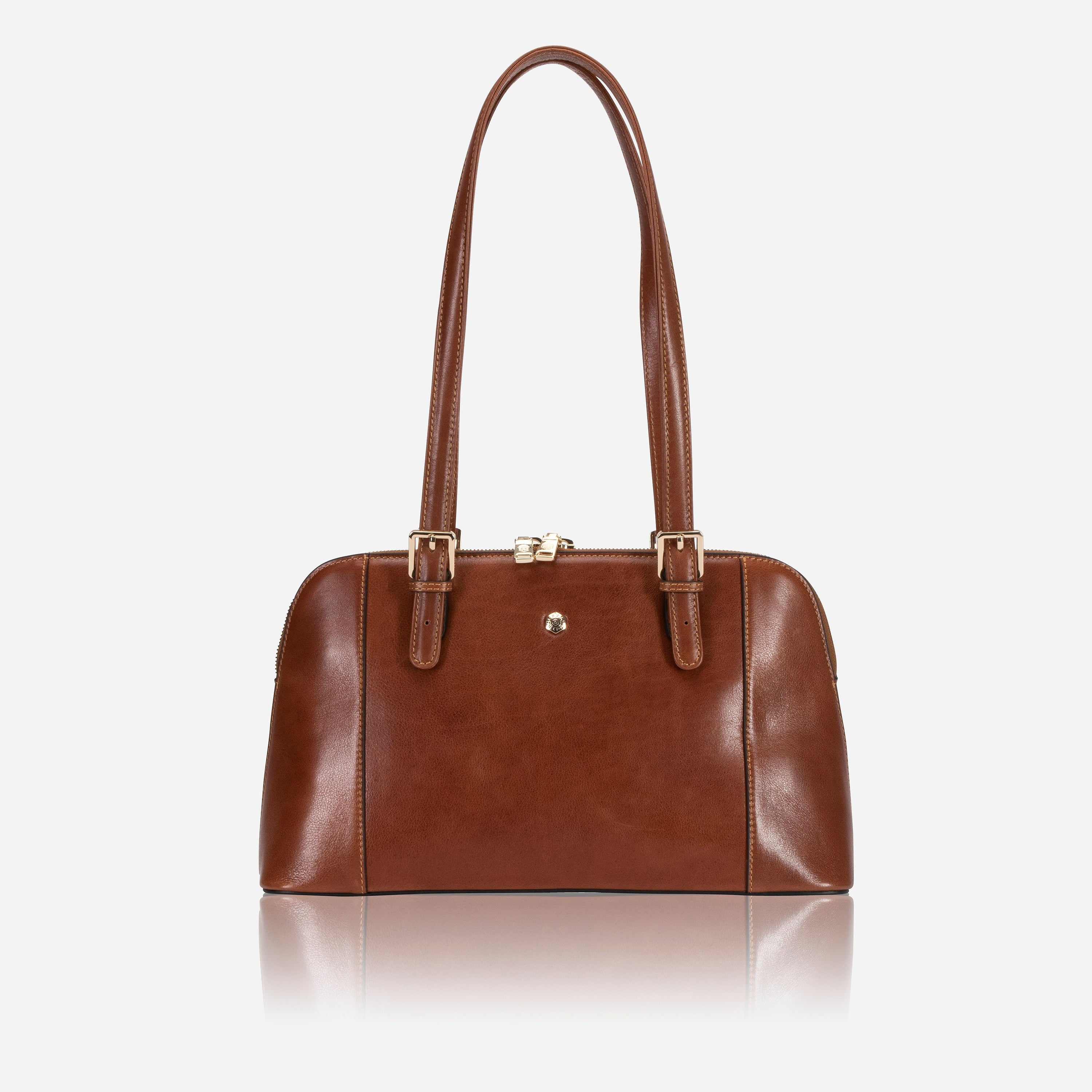 Madrid Handbag in Tan with adjustable straps and multiple pockets, showcasing its elegant design and ample space.