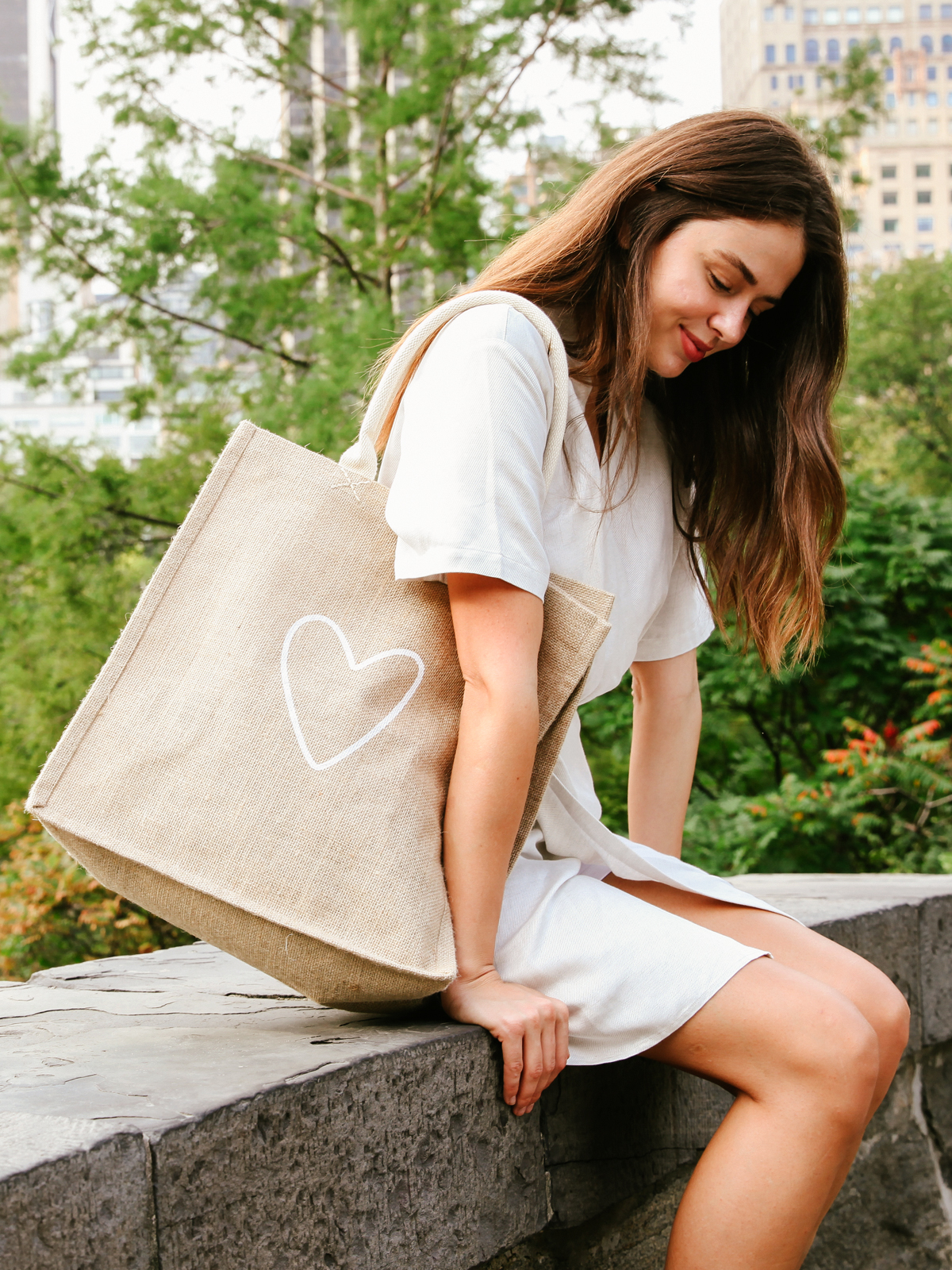 Eco-friendly Love Market Bag made from natural jute fabric, featuring a cotton handle and a spacious design for shopping.