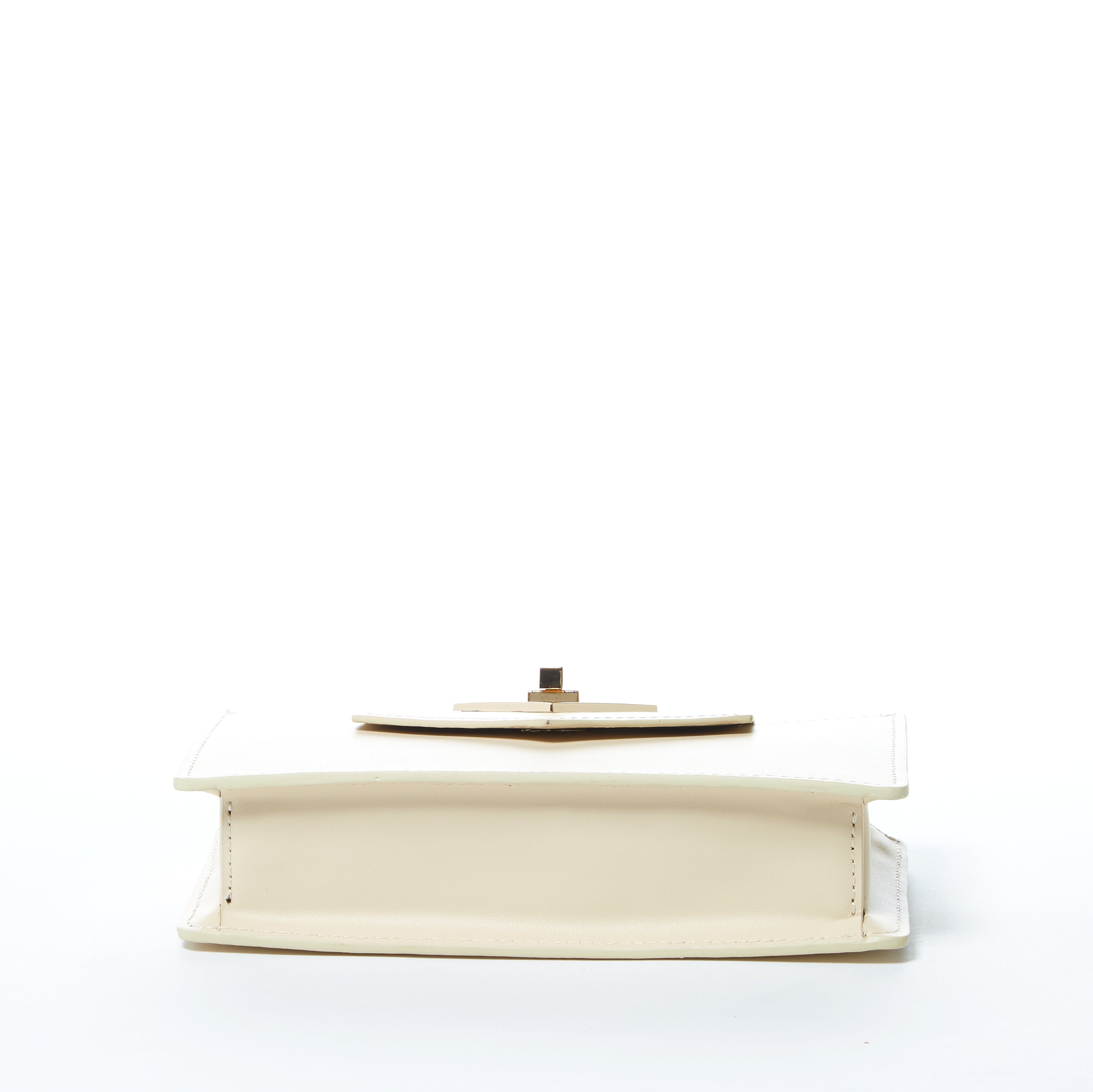 Mary Off White Mini Crossbody Bag featuring a geometric design, gold hardware, and a wrist strap, made from luxurious vanilla custard leather.