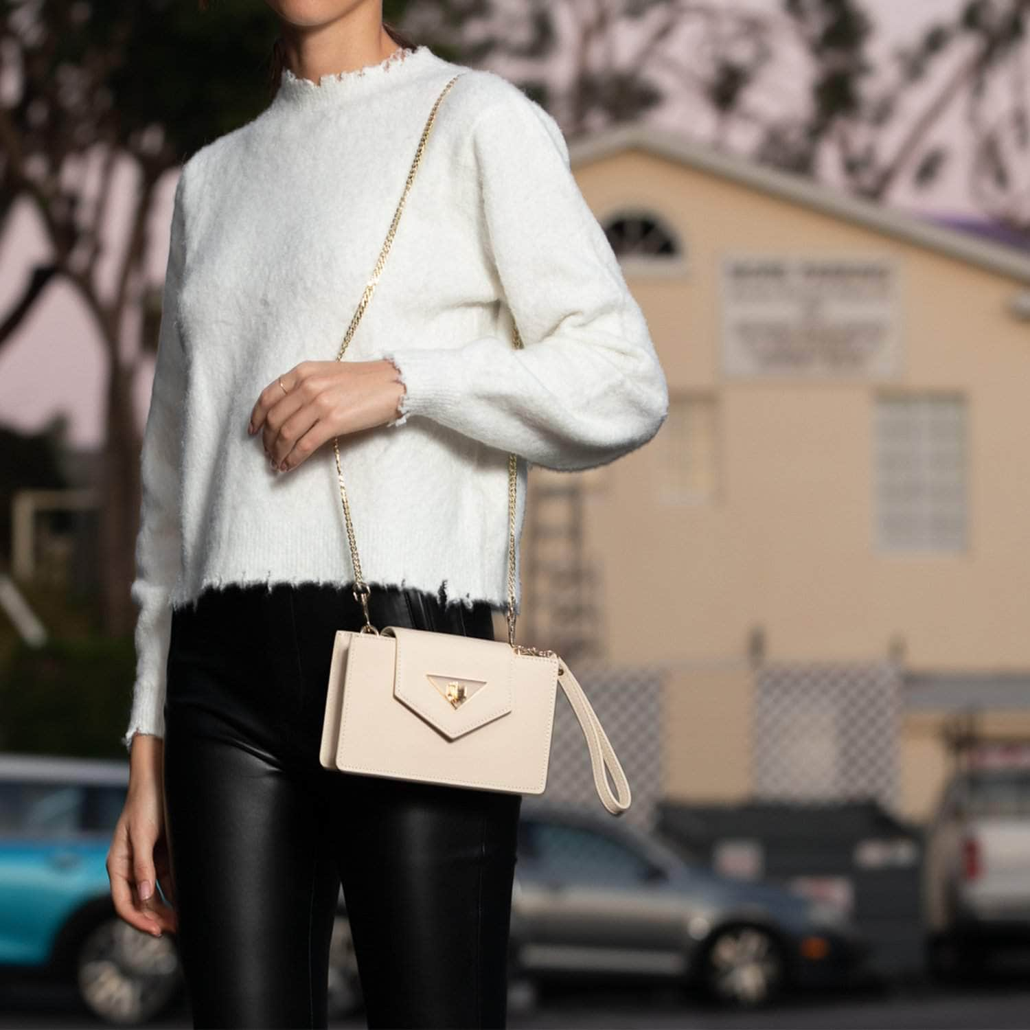 Mary Off White Mini Crossbody Bag featuring a geometric design, gold hardware, and a wrist strap, made from luxurious vanilla custard leather.