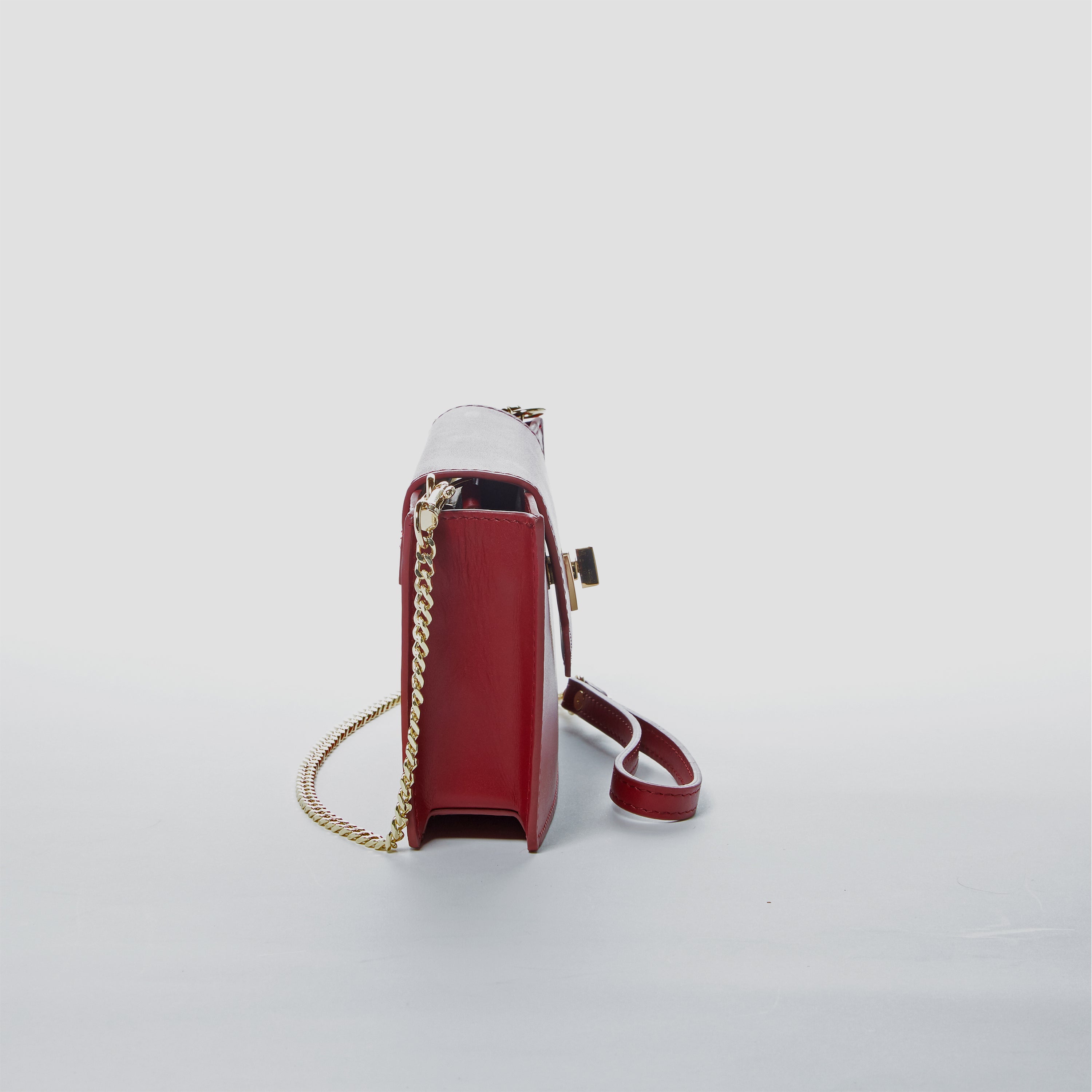 Mary Small Crossbody Leather Wristlet in Burgundy with gold hardware and wrist strap.